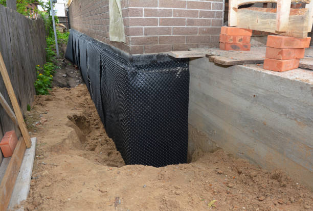 Happy homeowners after waterproofing job in Summitville